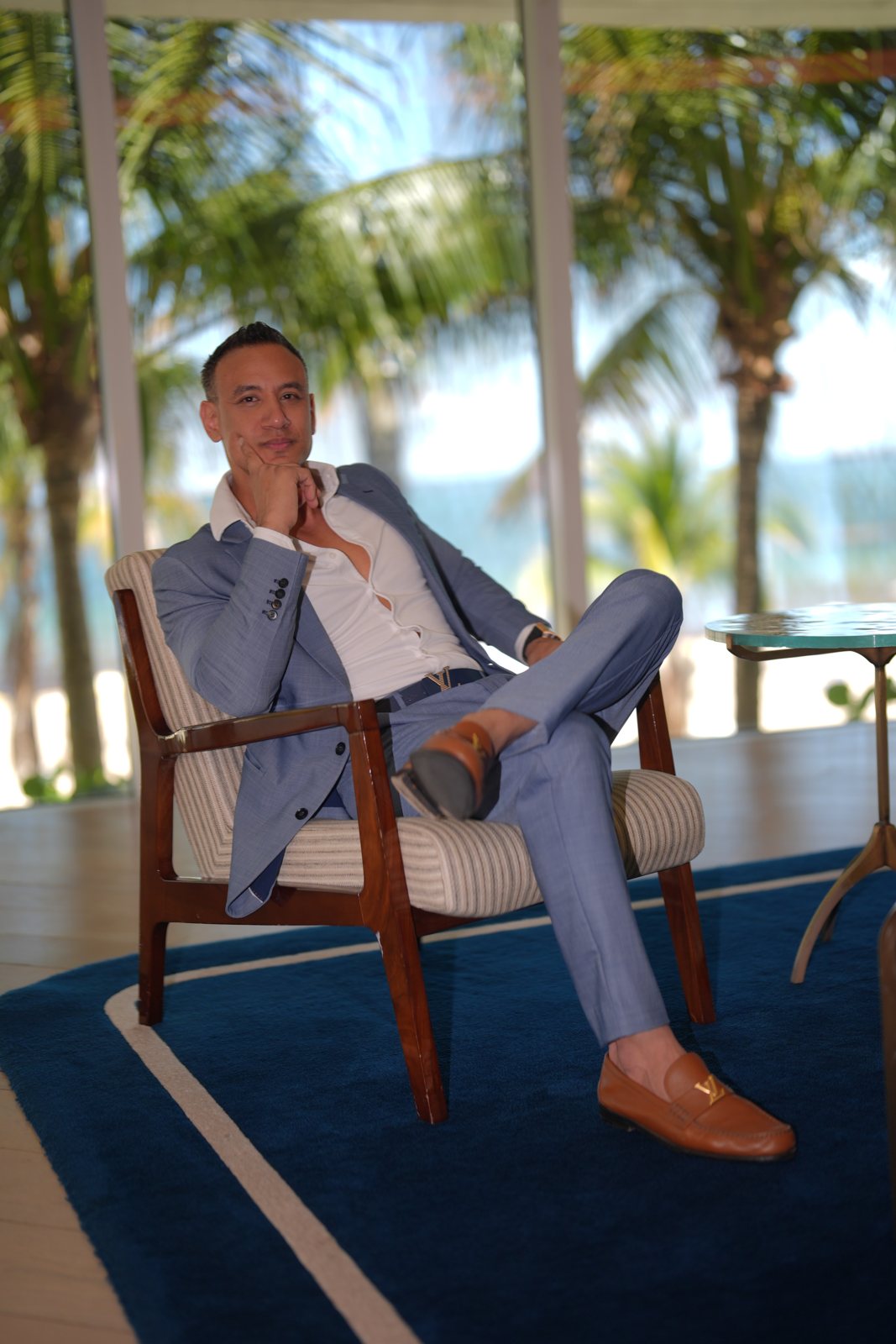 Jibrael Hindi, A Fit Lawyer, seated at a beachfront lounge